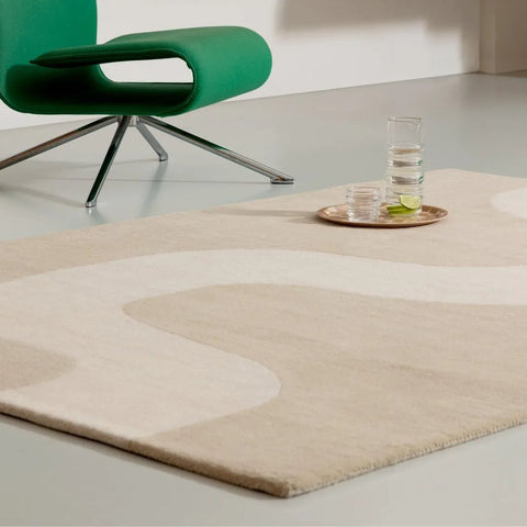 An organic flowing design by Marimekko on a small cream and ecru rug
