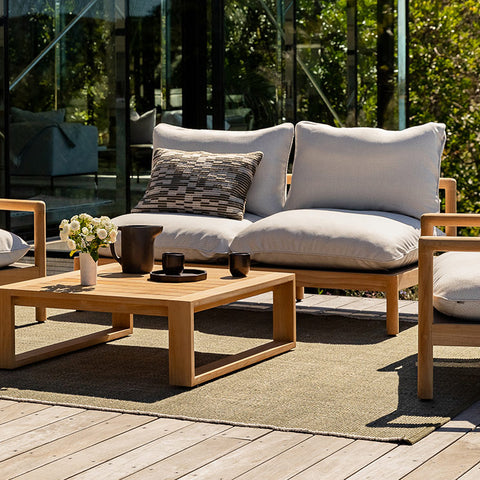 Outdoor rug and cushions by Baya