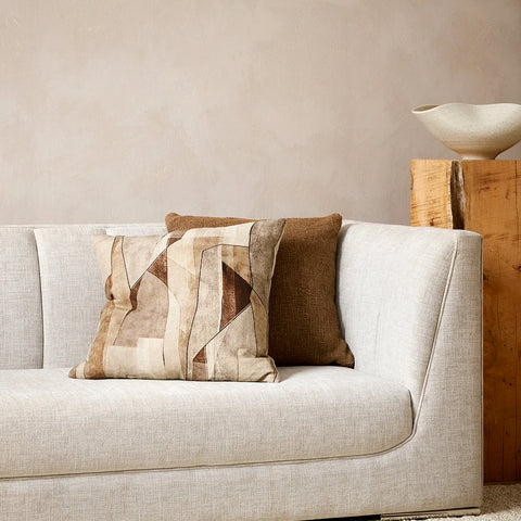 Patterned and solid brown toned cushions by Baya nz, on a couch in a contemporary nz living room