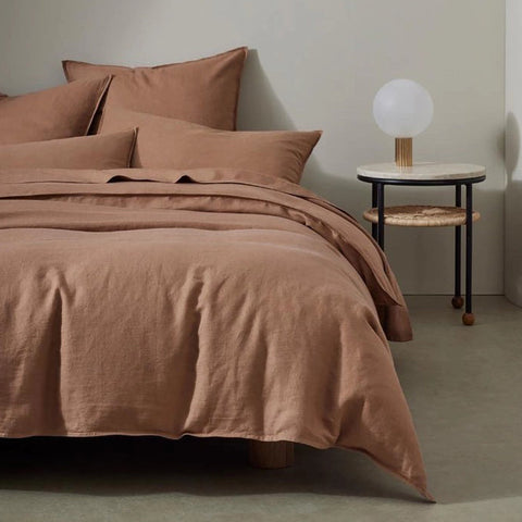 Warm, red brown premium French flax linen bedding by Weave Home