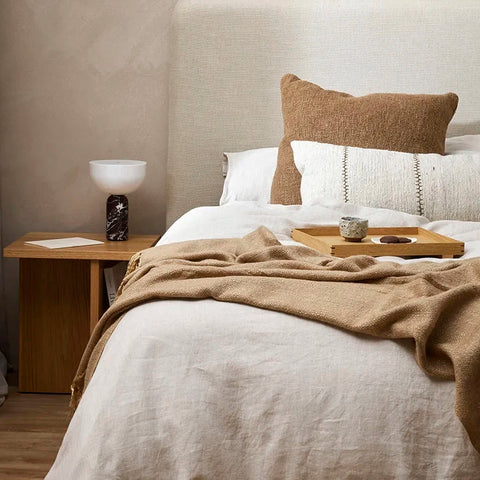 The Baya 'Nomadic Texture' collection of home decor including cushions and throw blanket