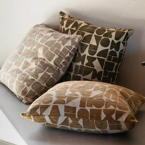 Three designer cushions featuring geometric patterns in on-trend colours, by Baya nz