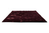 Perspective view of the Marimekko Unikko floral patterned rug with deep burgundy flowers