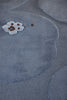 Close up of the Marimekko Unikko floral patterned rug with mid blue flowers at varying pile heights