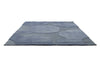 Perspective view of the Marimekko Unikko floral patterned rug with mid blue flowers at varying pile heights