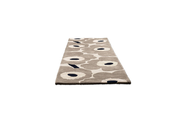 Perspective view of Marimekko hallway runner rug with floral patterned on a beige background