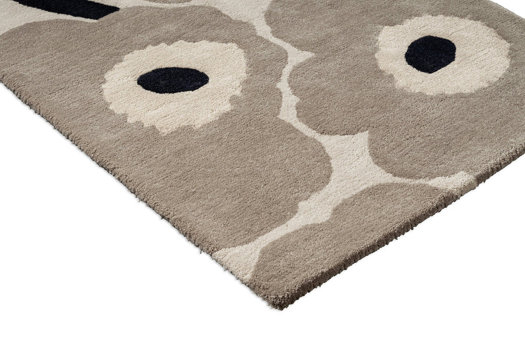 Close up corner of the Marimekko hallway runner rug in NZ wool with floral patterned on a beige background