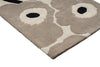 Close up corner of the Marimekko hallway runner rug in NZ wool with floral patterned on a beige background