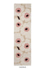 Marimekko hallway runner rug in NZ wool with white and pink unikko design on a beige background
