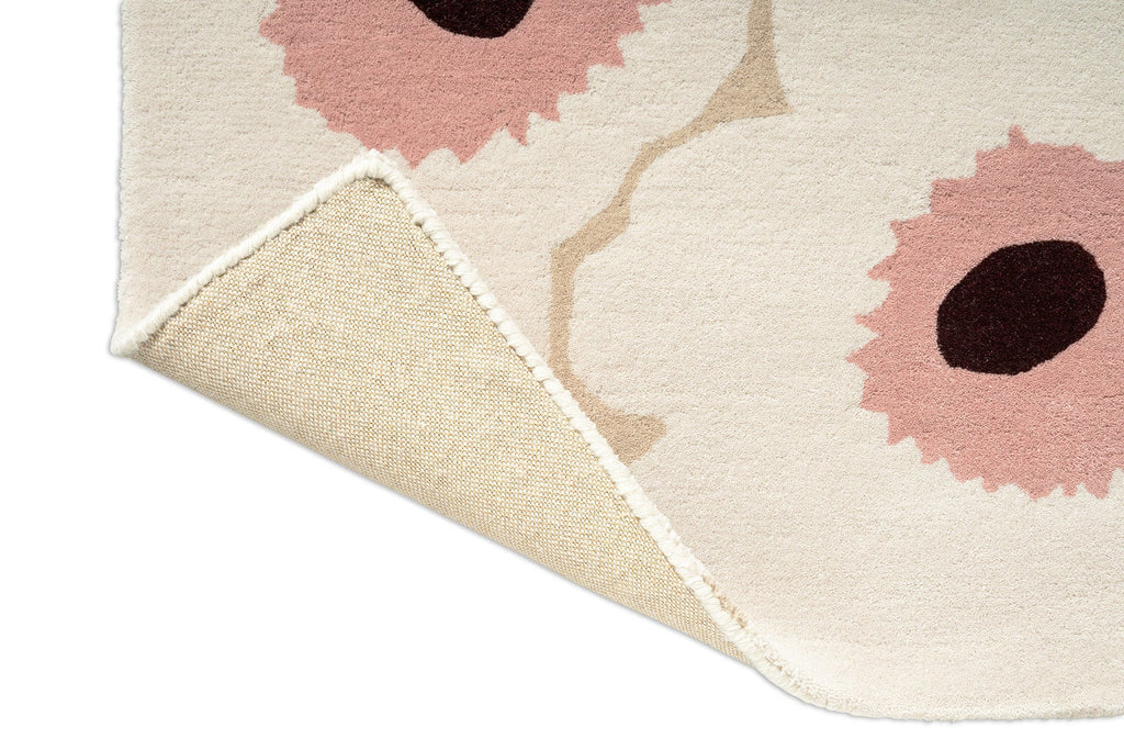 Marimekko hallway runner rug in NZ wool with white, pink and beige, corner folded to show backing