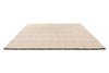 A Marimekko grid patterned rug in NZ wool and in a neutral creamy white, seen in perspective