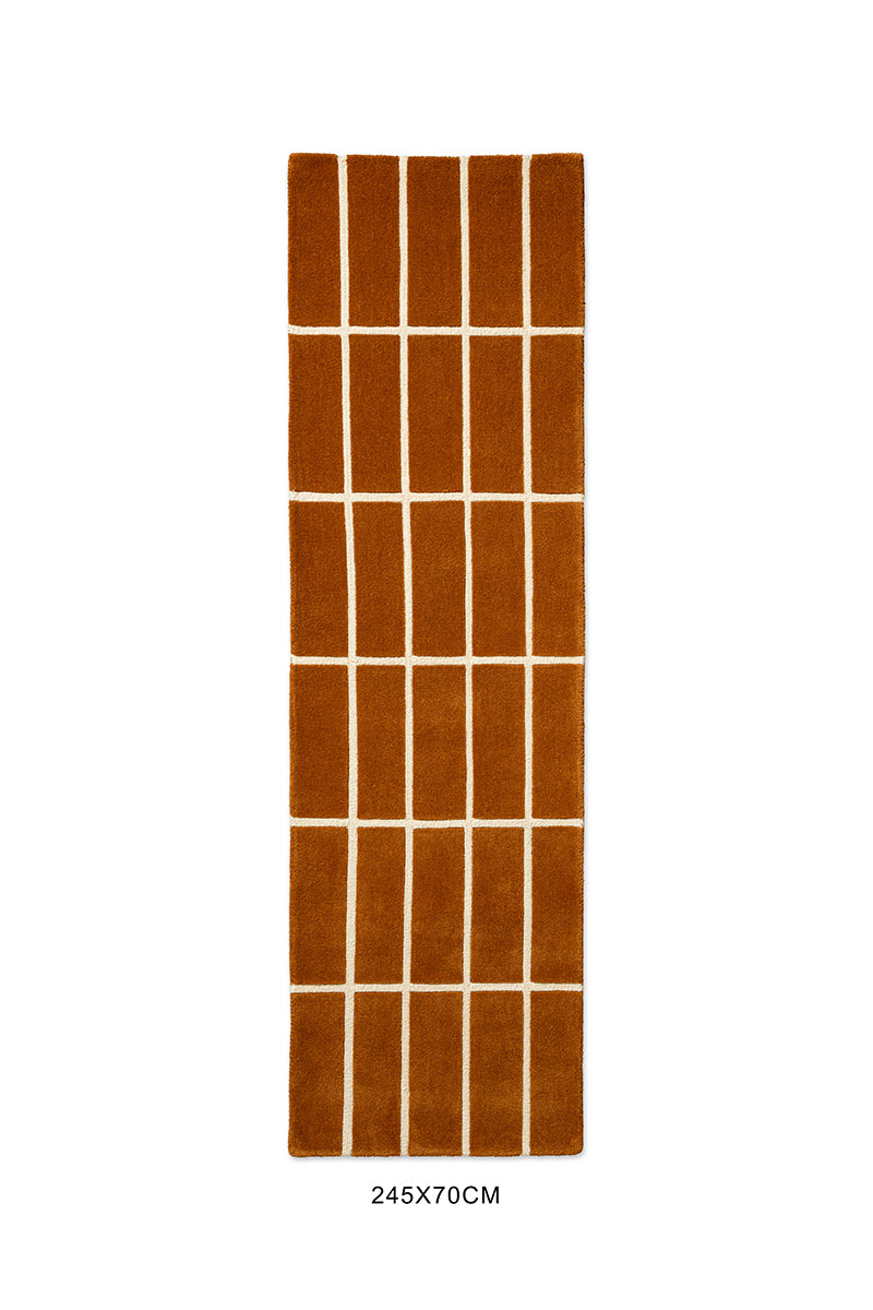 A Marimekko NZ wool rust patterned rug seen from above