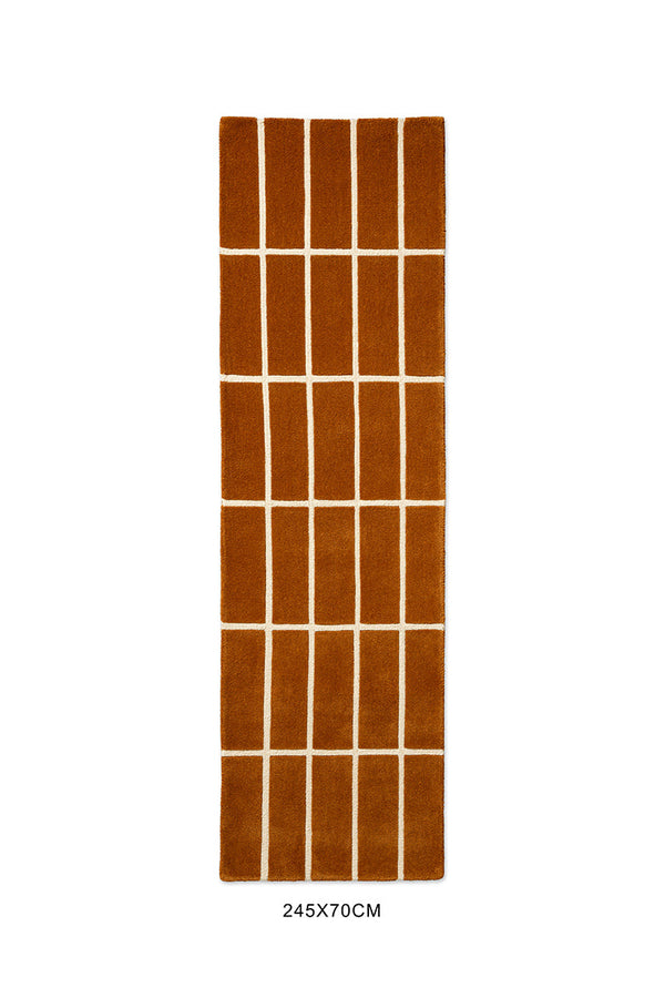 A Marimekko NZ wool rust patterned rug seen from above