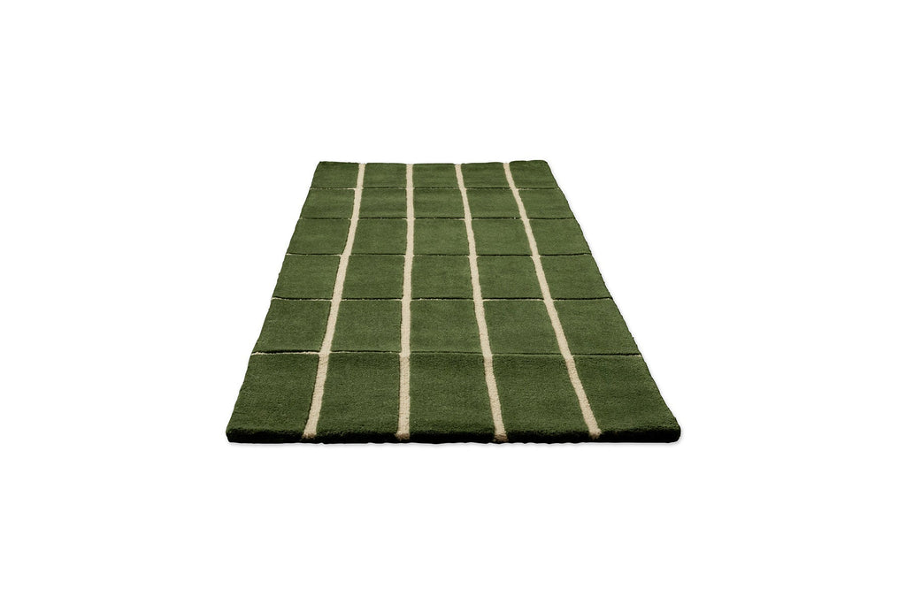 Perspective view of a green geometric Marimekko NZ wool runner rug 