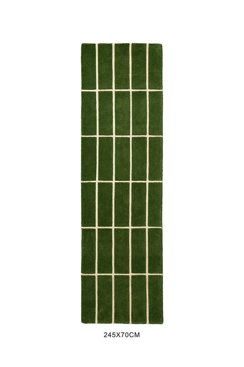 View from above of a green geometric Marimekko NZ wool rug 