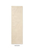 A Marimekko runner rug in a creamy white with a subtle graphic cut into it