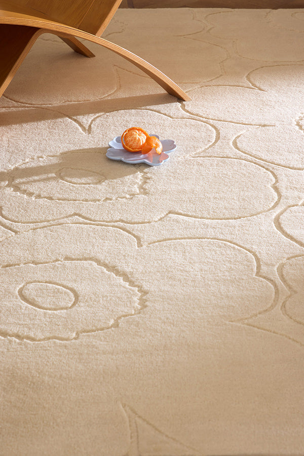 Close up of a creamy white Marimekko NZ wool rug in a living room
