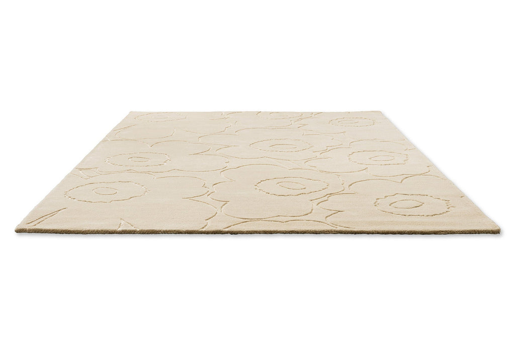  A creamy white Marimekko NZ wool rug with a subtle floral unikko graphic shown in perspective