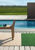 Designer outdoor rug in green and beige stripe, poolside, made by Brink and Campman