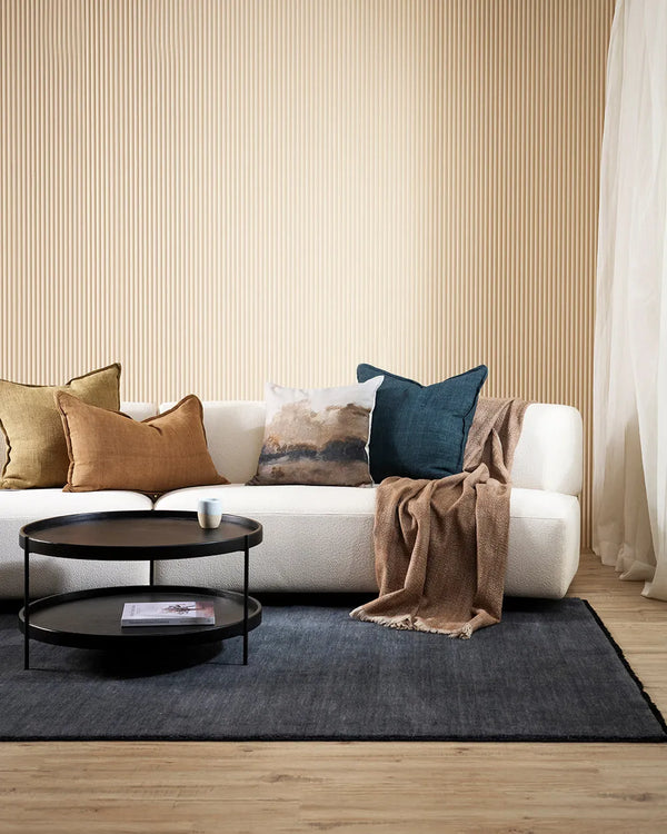 The Baya Sandringham 100% wool floor rug in colour 'Storm Blue' seen in a modern living room