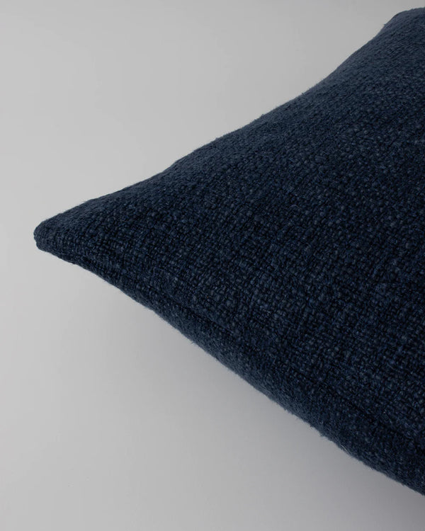 Close up of the textural weave of the Baya Cyprian cushion in colour midnight