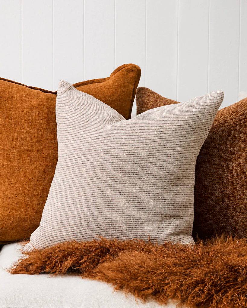 The Sandridge pinstriped cushion by Baya in linen and rust colourway