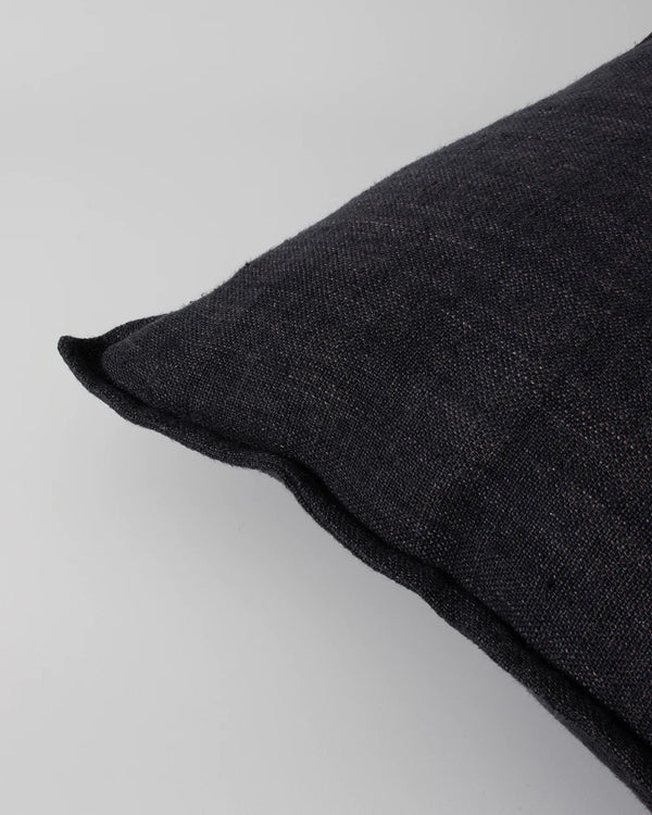 Close up of the textural weave and flange edge of the Baba Black flaxmill cushion