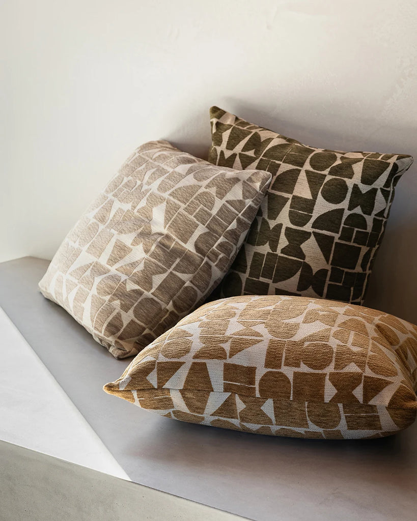 Baya geometric patterned cushions in brown, green and mustard ochre