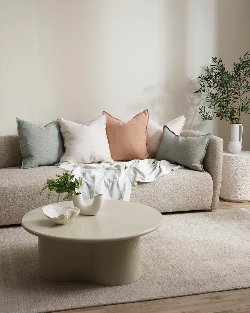 Modern living room setting featuring neutral tones and Baya flaxmill linen cushions