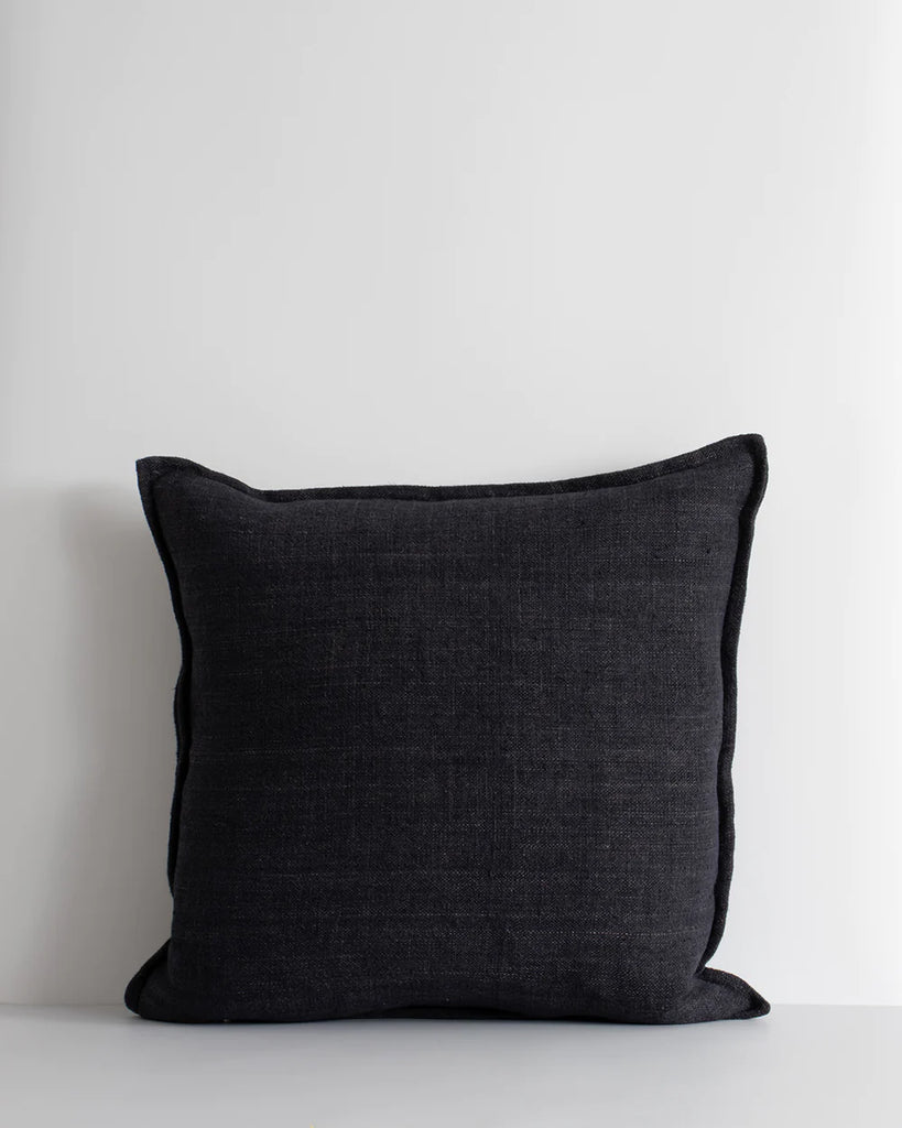 Black textural linen cushionw ith a flange edge, by Baya