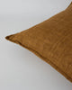 Close up of the Baya Cassia linen cushion, with flange detail, in colour tobacco brown