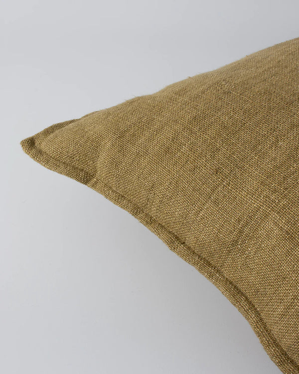 Close up of flange edge and textural detail on the Baya Flaxmill cushion in colour fenugreek