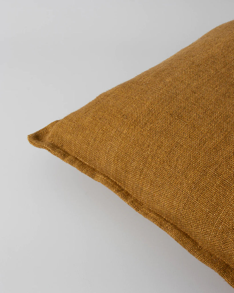 Close up of Baya Flaxmill cushion in warm colour nutmeg 