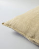 Close up of the Baya linen cushion in colour 'putty' - a light brown - beige tone