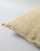 Close up of the Baya linen cushion in colour 'putty' - a light brown - beige tone