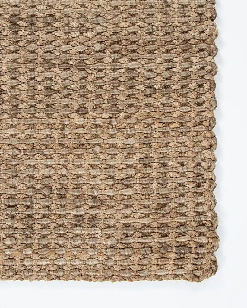 Close up of the corner of the Baya Lorne door mat , showing the textural weave in 100% jute