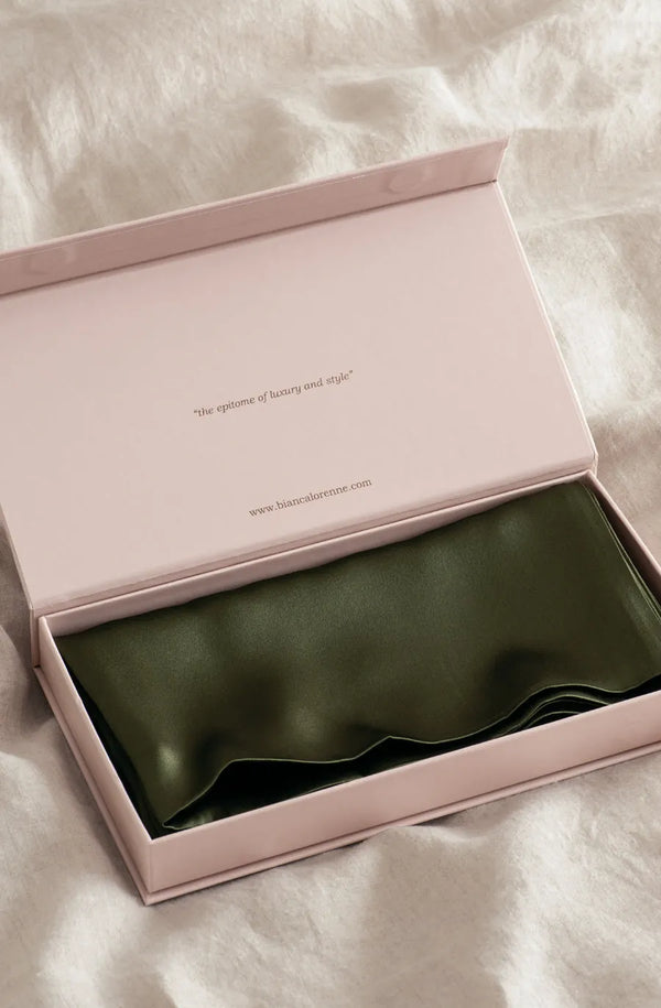An olive green silk pillowcase by Bianca Lorenne in an elegant gift box