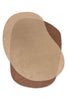 Full view from above of an organically shaped handtufted wool rug in caramel and warm brown tones by Brink and Campman