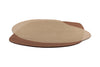 Full view from the side of a caramel and warm brown toned floor rug, in an irregular oval shape by Brink and Campman