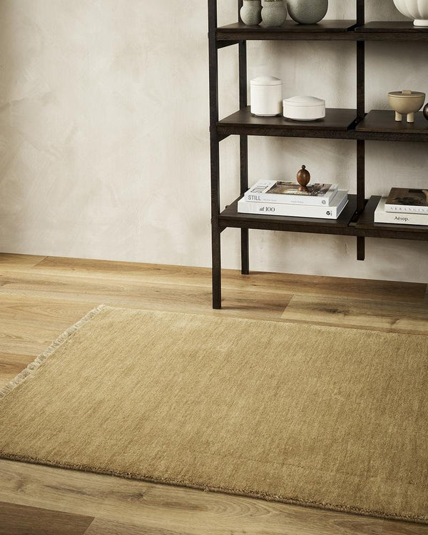 A hallway with a 100% wool runner in a mid-neutral brown tone. 