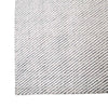 Close up of the corner of a charcoal and white patterned floor rug by Globe West and Soren Liv NZ