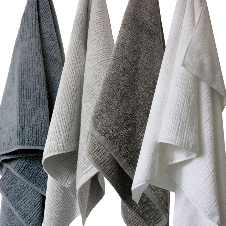 Soft Chelsea bath towels hanging - four colours - charcoal, mist, white and ink