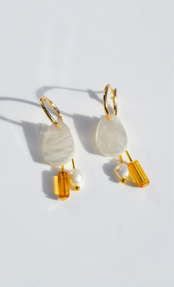 NZ designer Hagen and Co dangle earrings feathring acrylic, glass beads, and a freshwater pearl charm