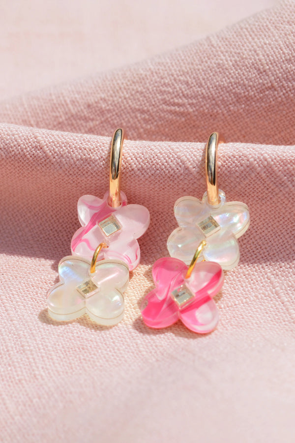 Marbled pink acrylic dangle earrings with a pacific floral theme, by NZ designer Hagen + Co
