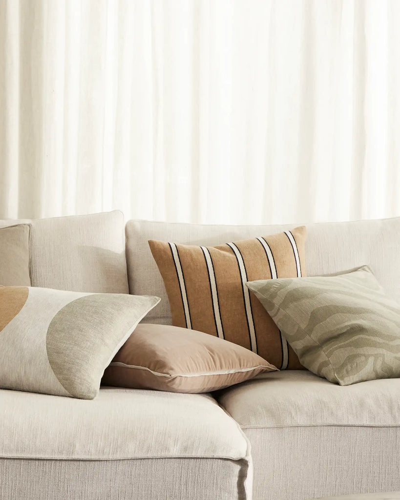 A sophisticated Weave Home nz combination of stylish cushions on a couch