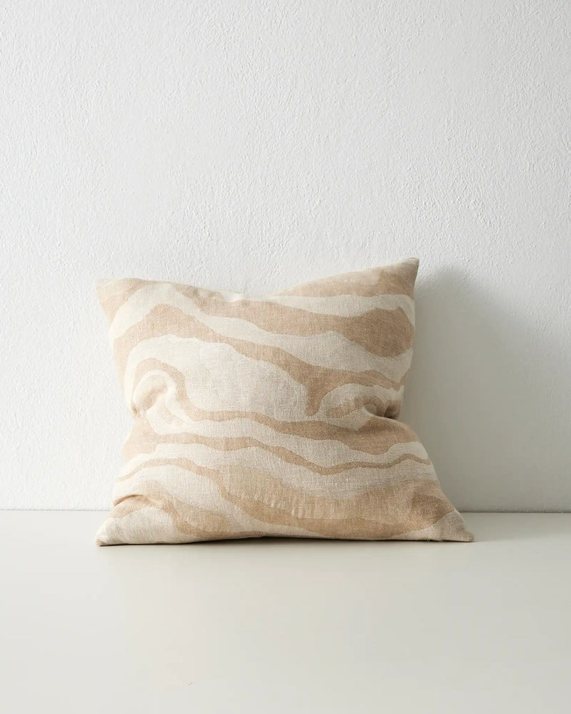 The Weave Home Clunes Linen cushion featuring sandy beige toned organic wave design