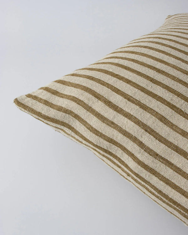 Close up of the Baya 'Spencer' linen cushion featuring a natural linen and ochre stripe