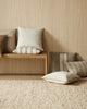 A selectioon of neutral cushions by Weave Home, seen in a modern living space