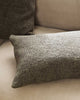 A lumbar cushion in shades of warm, deep green, in a very soft textural weave, by Baya. 