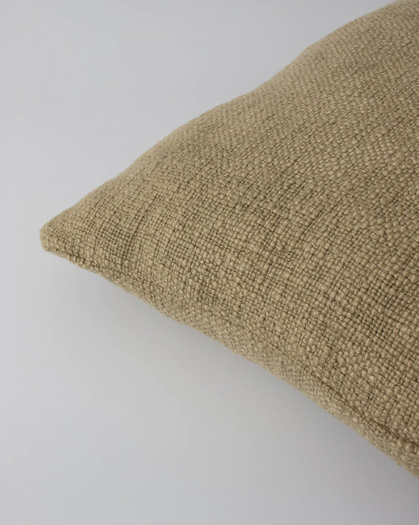Close up of the Baya cyprian cushion which shows its beautiful textural weave